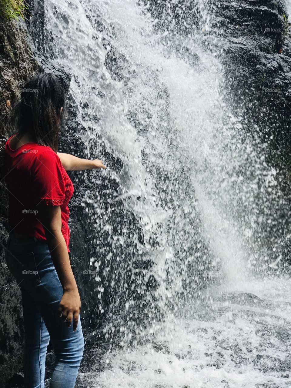 travel in the waterfall and feeling cool with touching water 