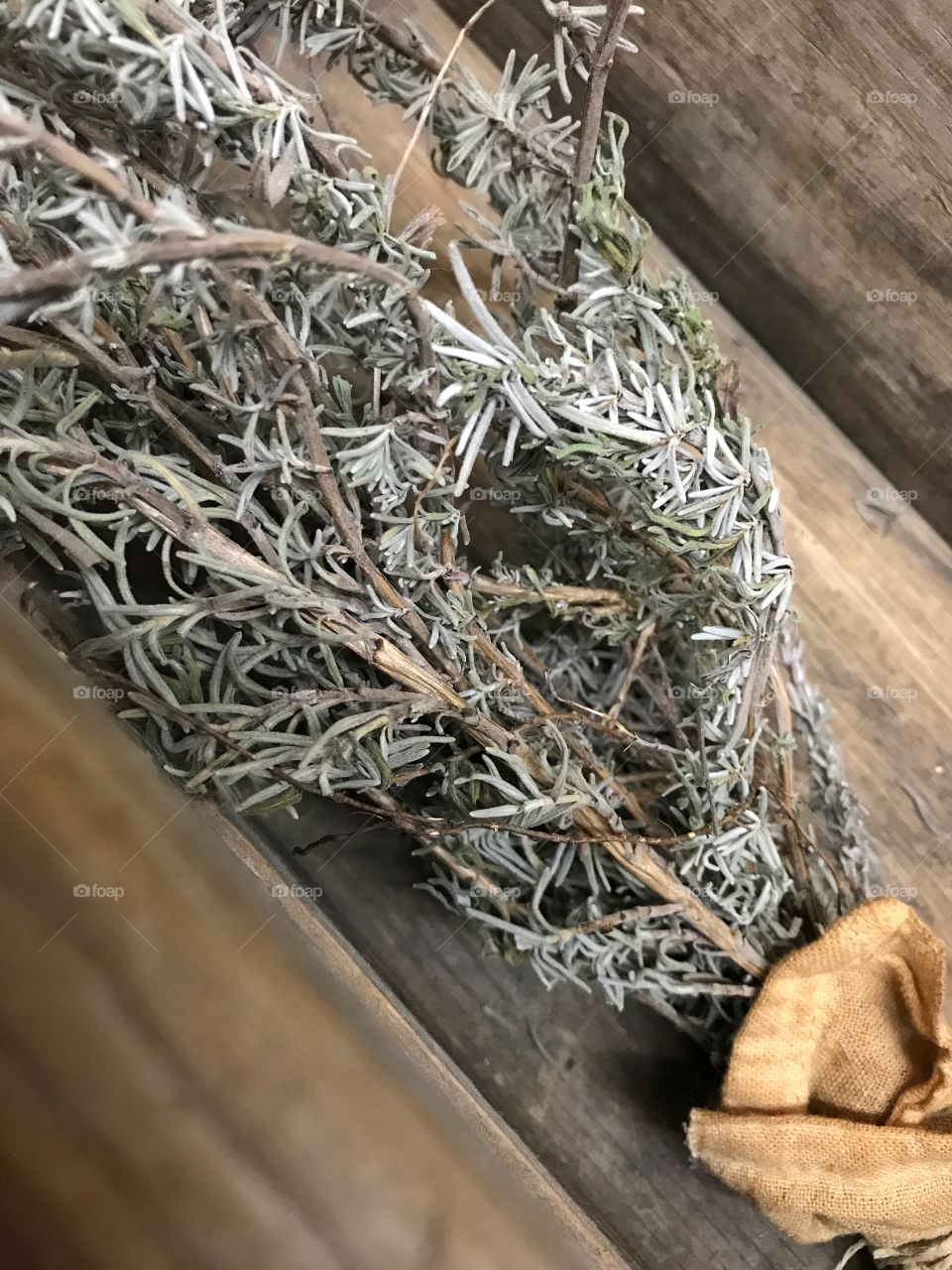 Dried rosemary in a wooden box