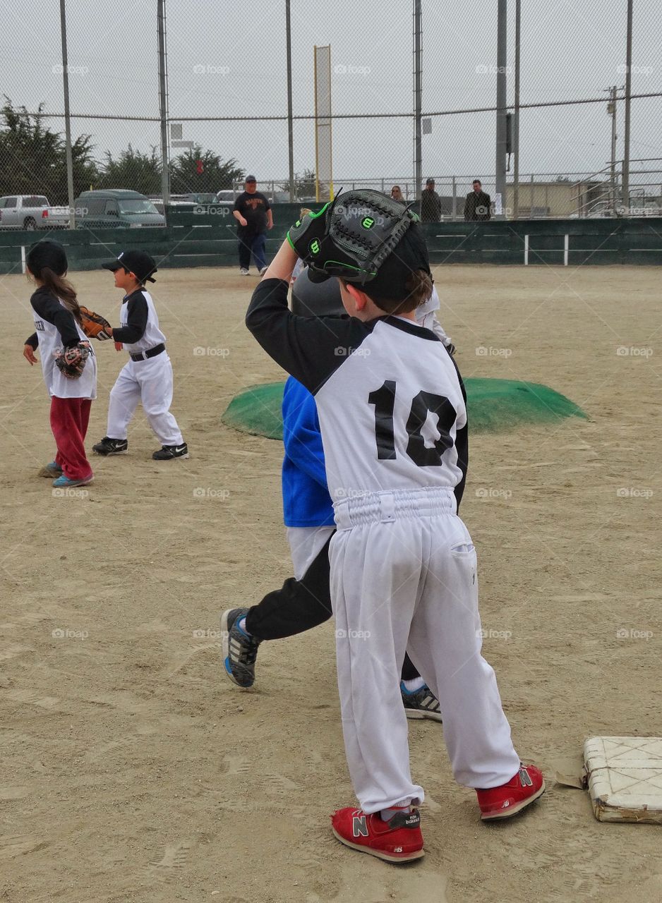 Little League Baseball. Children Playing American Little League Baseball
