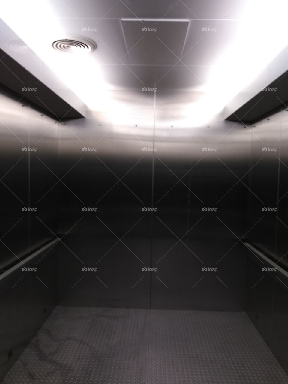 inside freight elevator, looking to the back