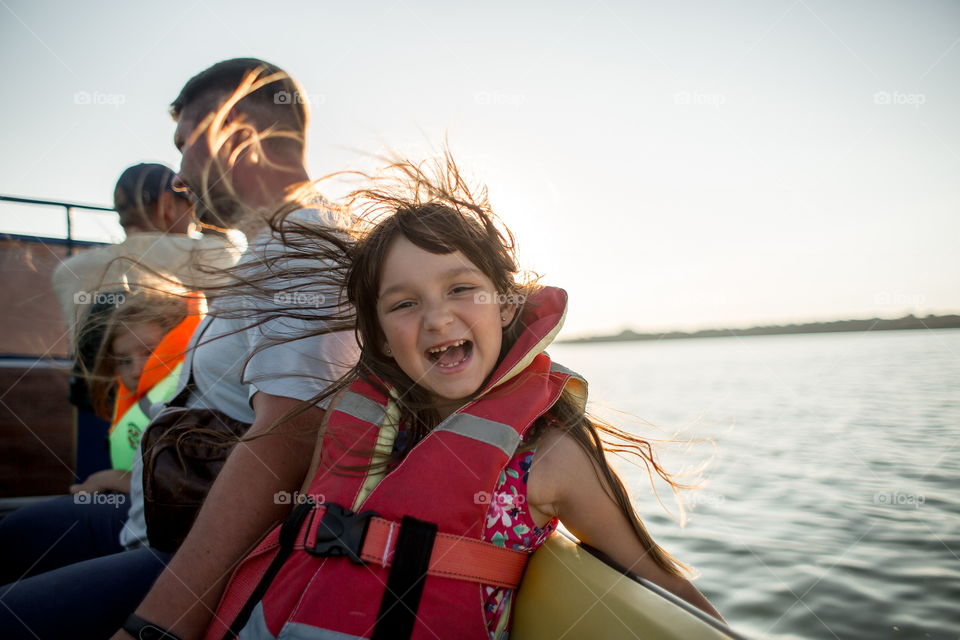 Funny girl portrait in a boat