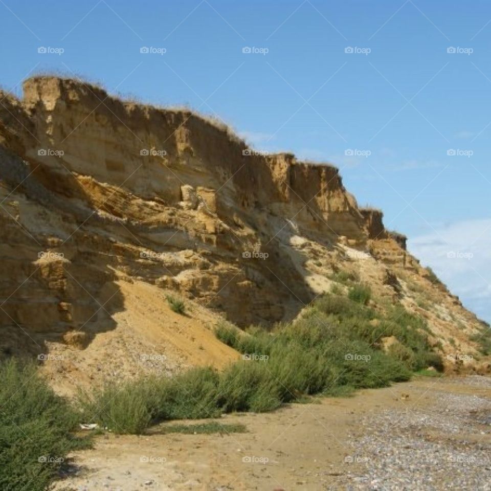 beach sand sea cliffs by sunnydee