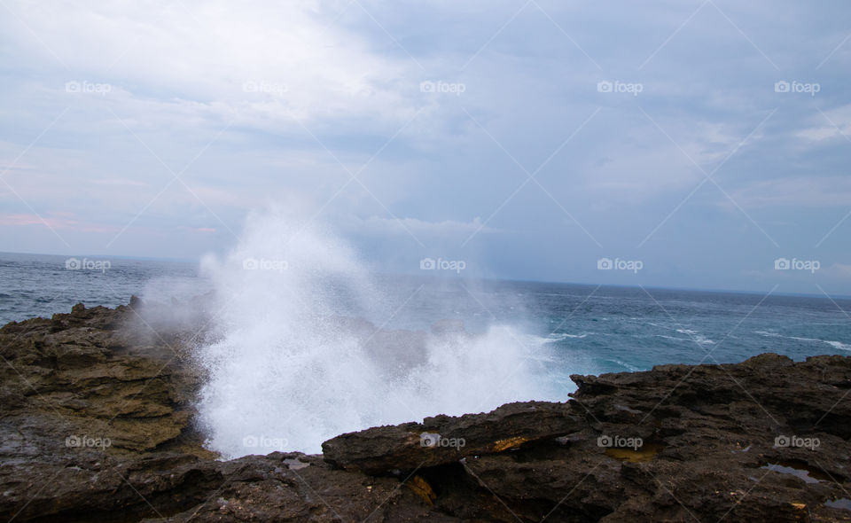 Waves hitting the Rocky shore of southern Nusa Lembongan Indonesia