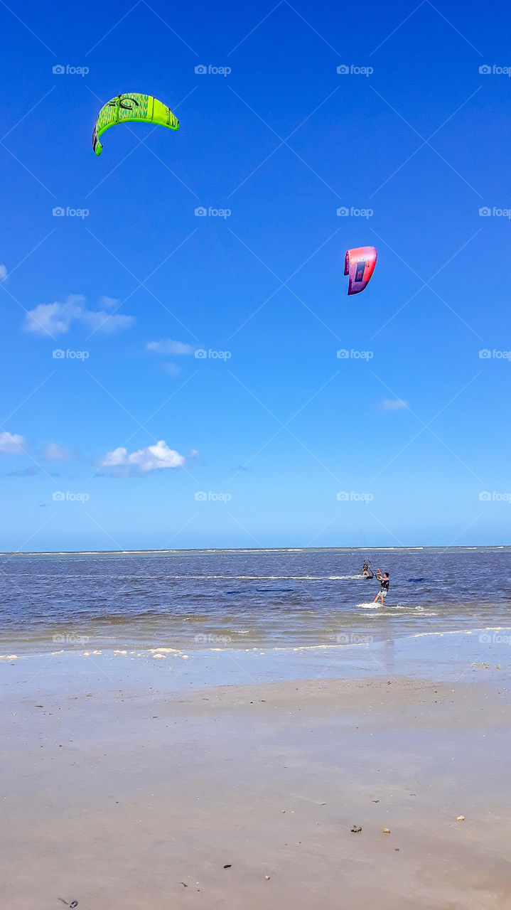 Kite surfing on Candeias beach, Pernambuco, Brazil.
