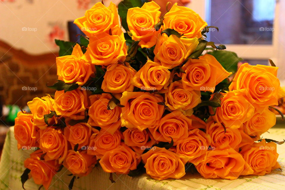 yellow roses on the table