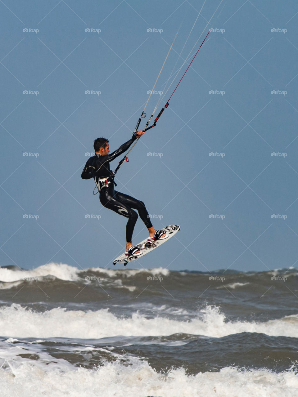 Kite surfer jumping high