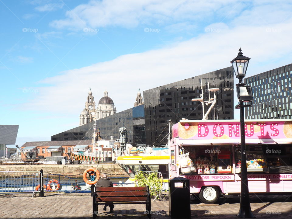 Donut street food truck in the harbour of Liverpool, England on a sunny and beautiful warm day.