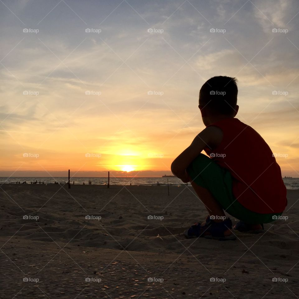 A kid and sunset 