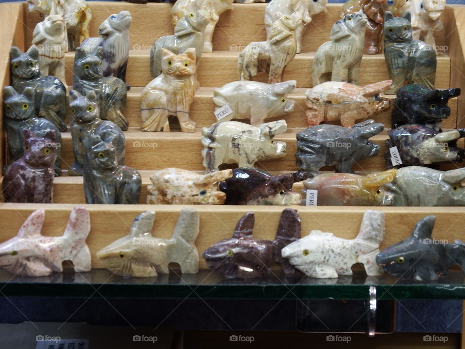 Carved stone figurines on display.