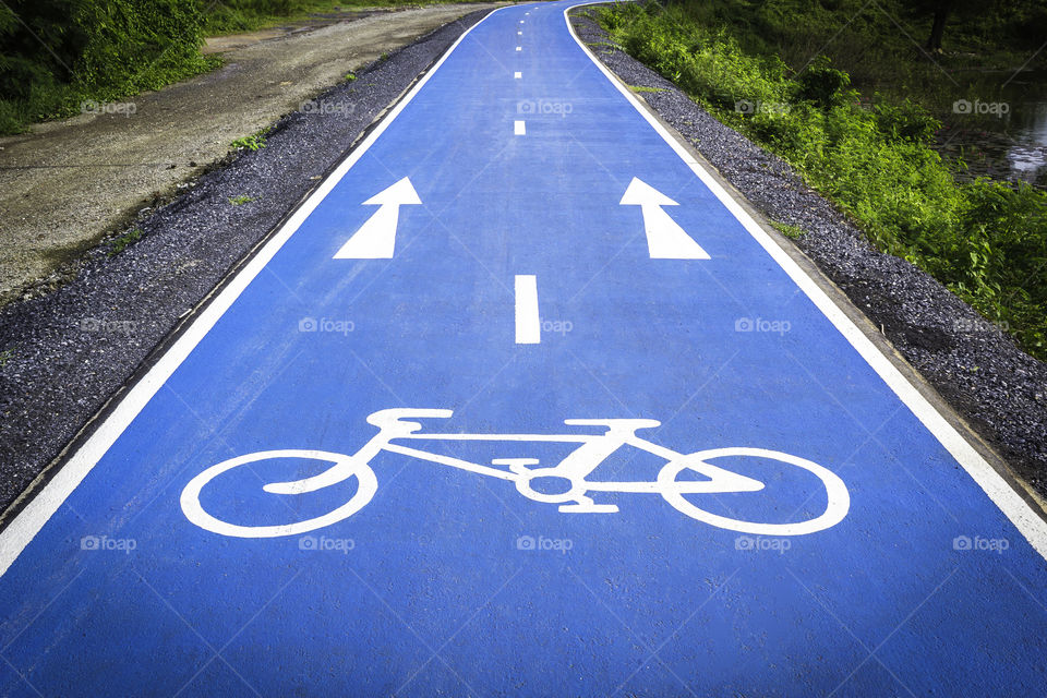 Bicycle symbol lane on the blue background road