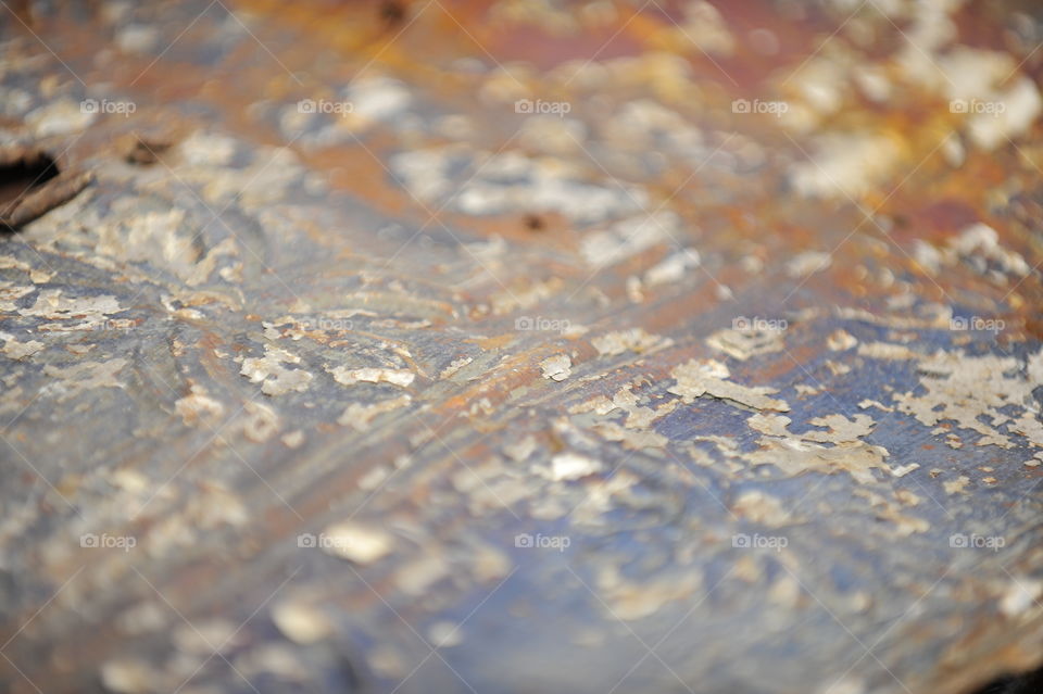 Textures; patina on stamped tin peeling paint
