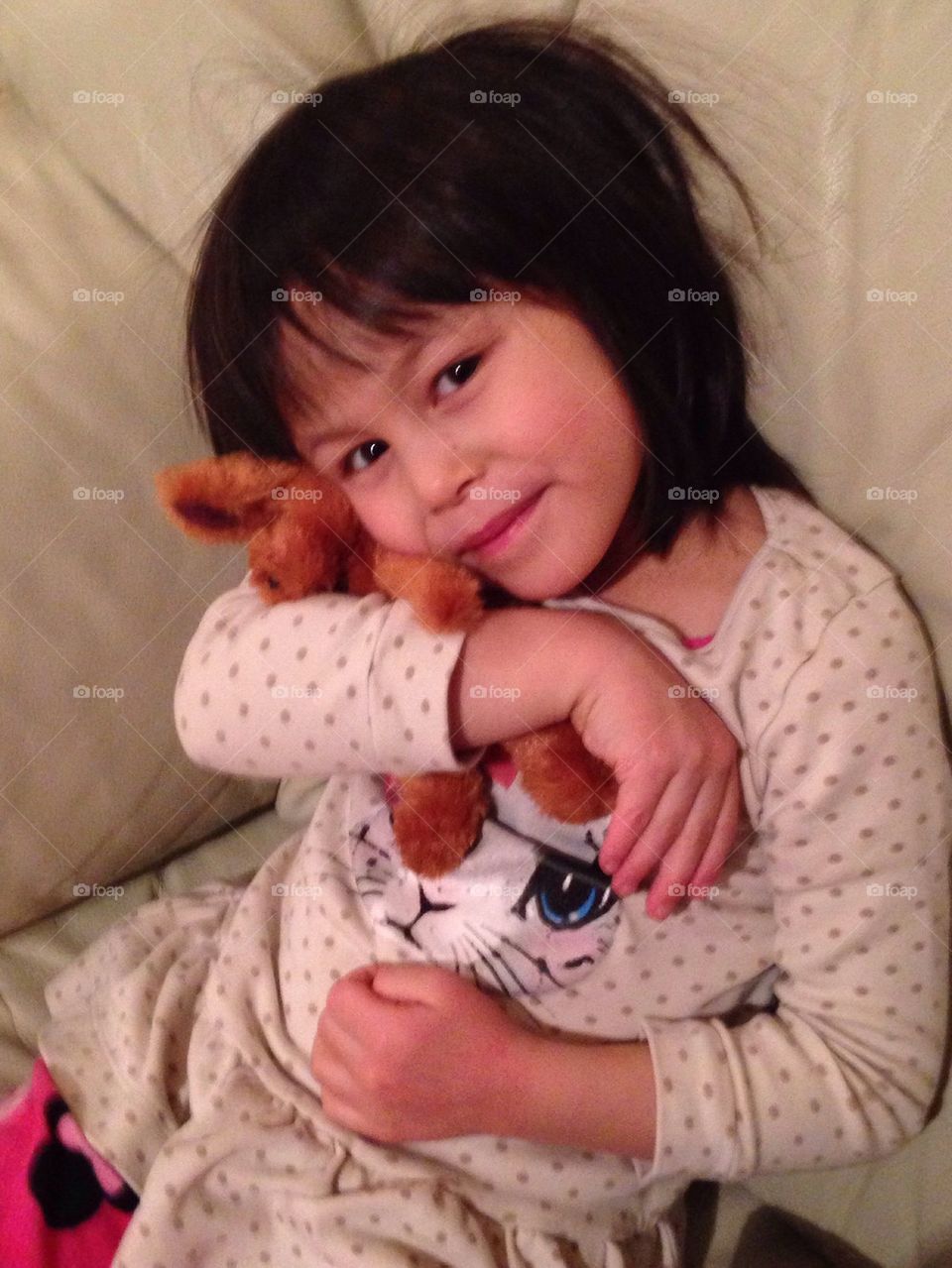 A girl and her stuffed animal