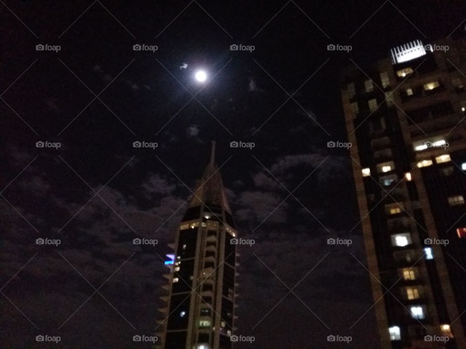 full moon  top of building