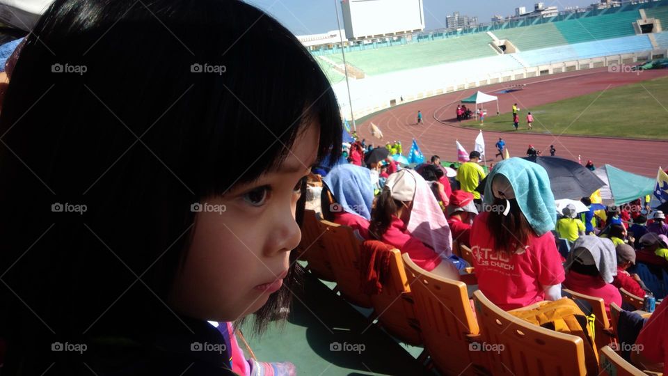 Hiding from big sunshine, still a beam of it on the face