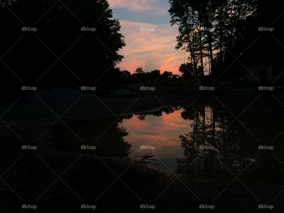 Sunset reflected in a puddle