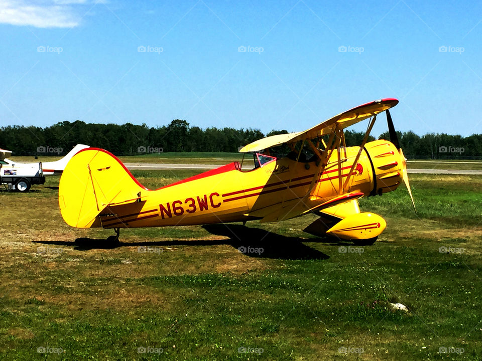 color stories a yellow Cessna biplane 