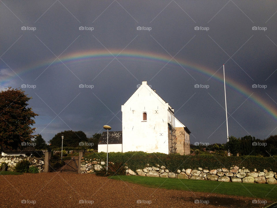 Rainbow over church 