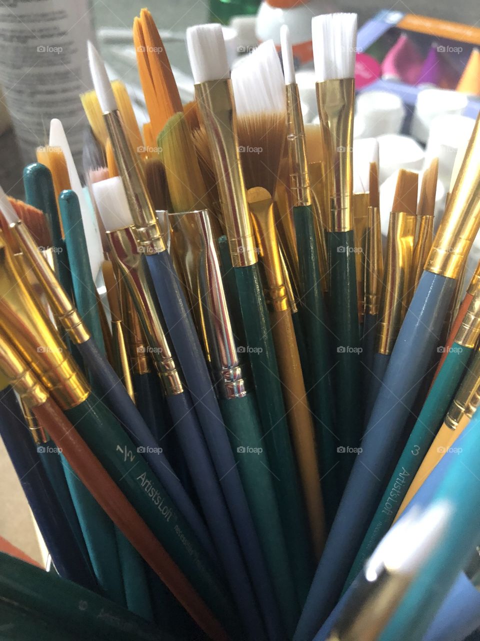 Paintbrushes in a can