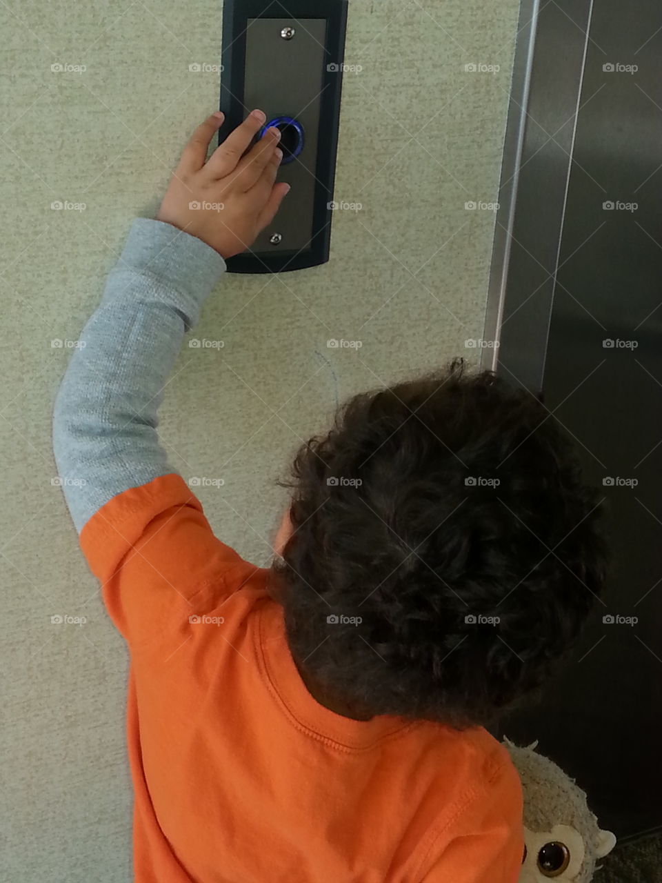 going up. boy at elevator,  pressing elevator button,  elevator door, riding elevator