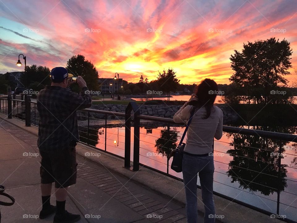 Enjoying the sunset . Having dinner on the lake 