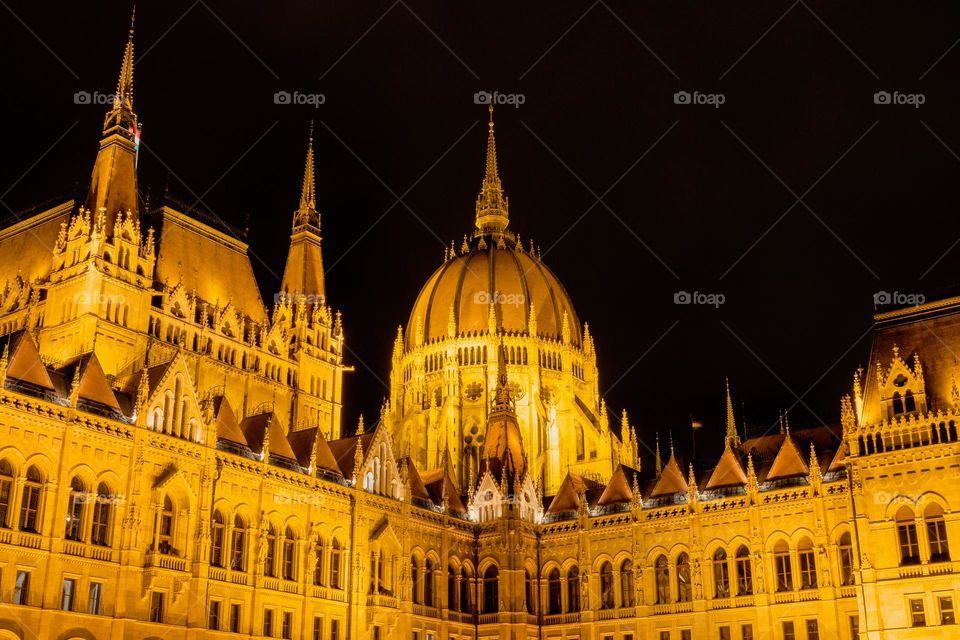 Low angle view night photo of famous Hungarian parliament building in Budapes