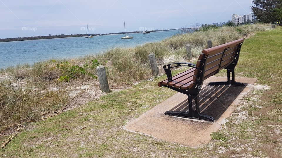 Park bench for rest and relaxation broadwater side