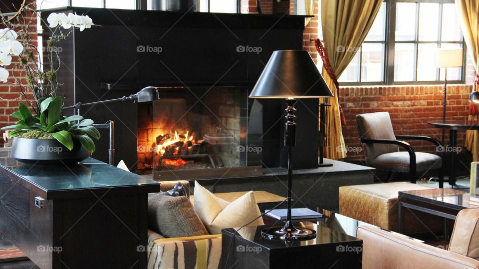 Lounging in luxury. Chic living room with fireplace