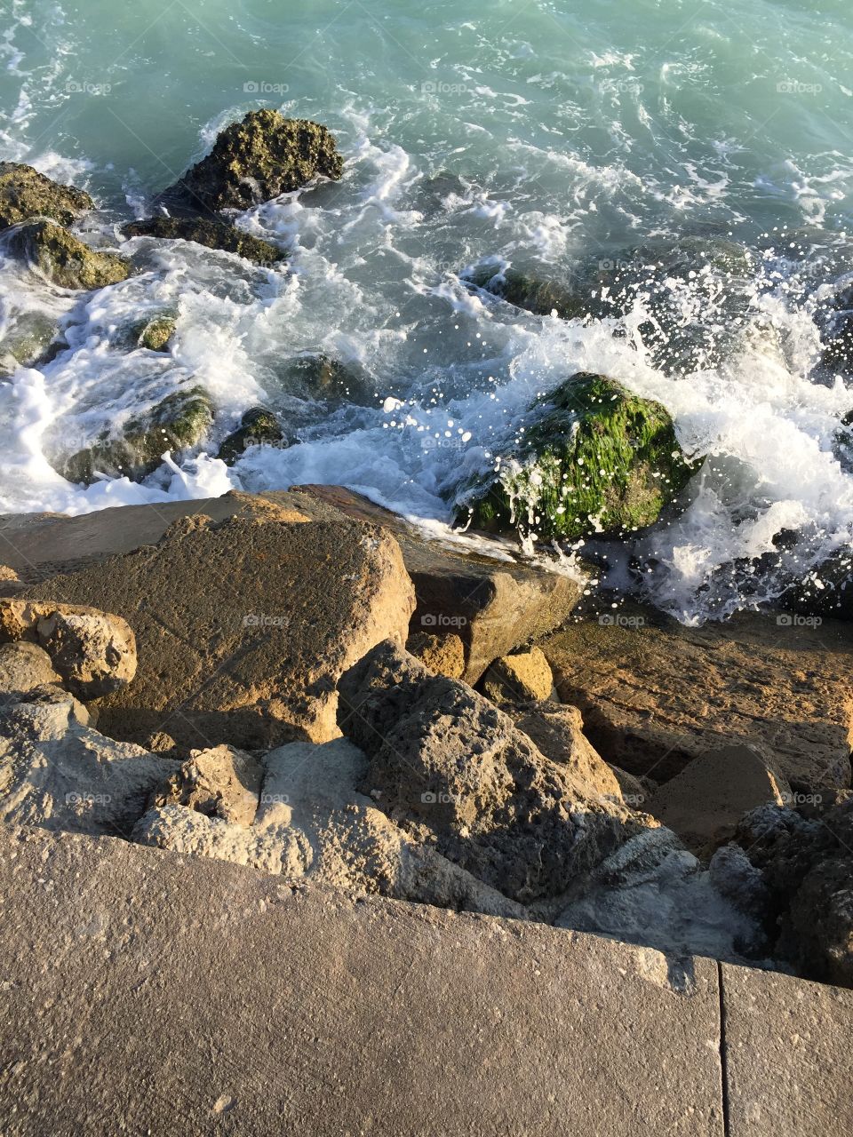 Waves splashing on rocks