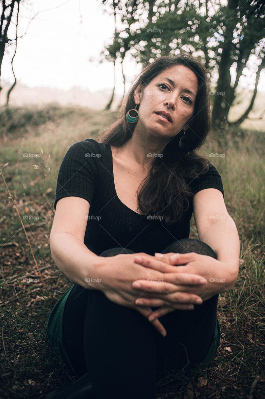 Woman sitting in nature observing