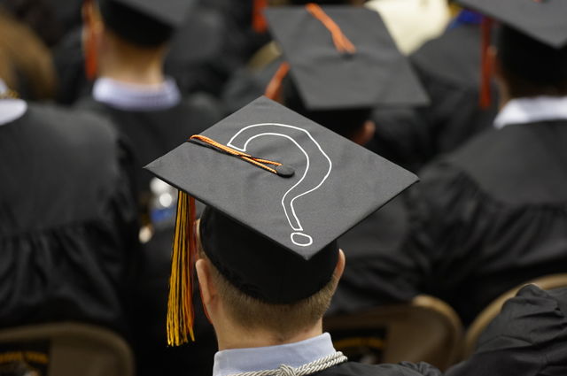 Rear view of graduates in caps and gowns