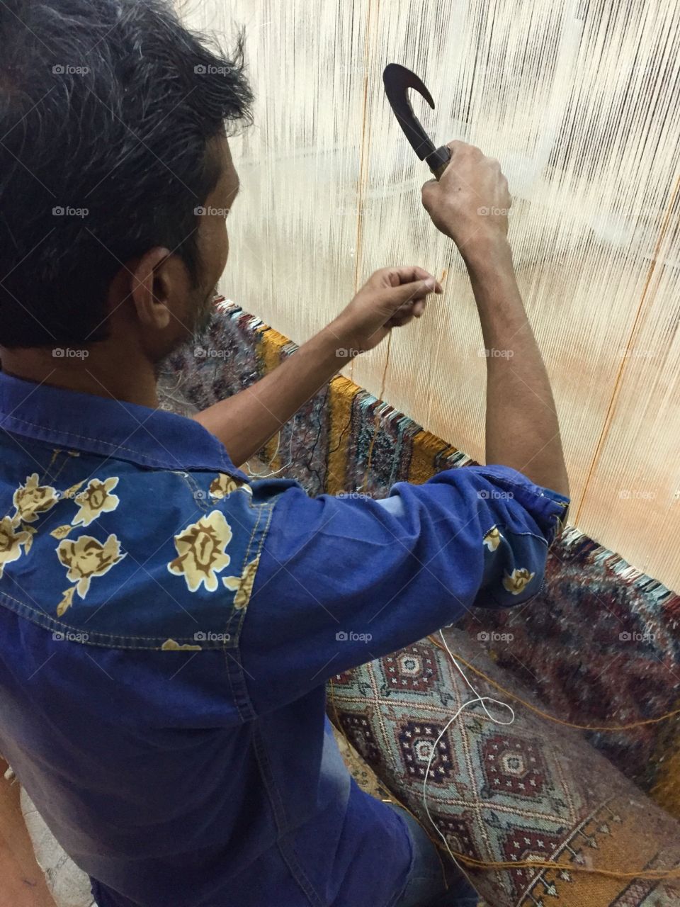 Rug maker in Agra, India