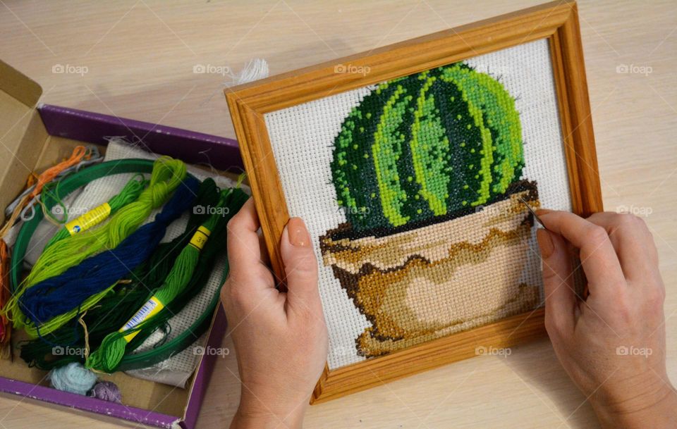 green cactus art from cross stitch in the female hands, love green 💚