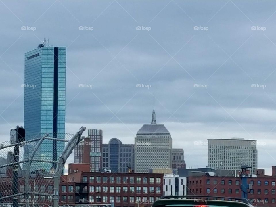 Boston skyline on grey cloudy day.