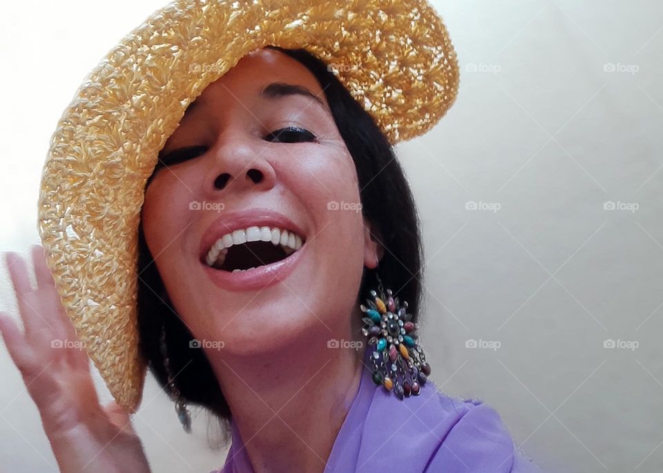 Portrait of Beautiful Smiling Woman with Yellow Hat