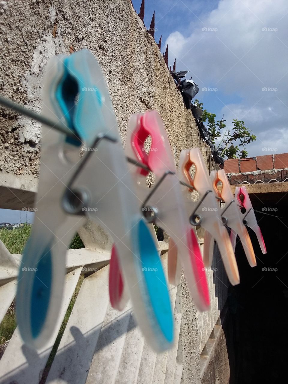 Colorful clothespins on the clothesline.