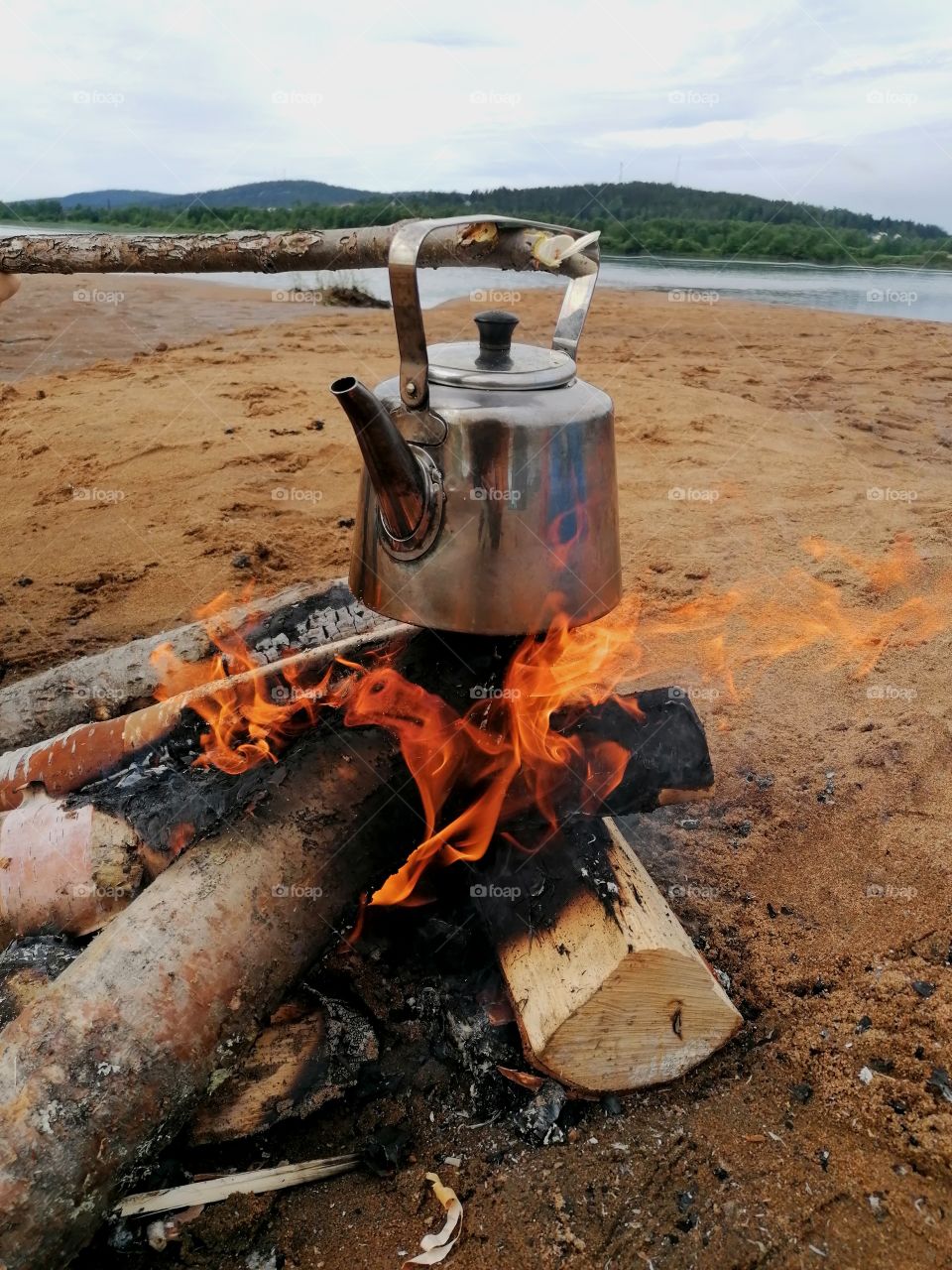Soot pot of coffee coming by the campfire. We are on an island in Lapland, Finland. Wonderful outdoor life!