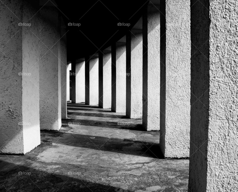 Light and shadow in the pathway with columns.