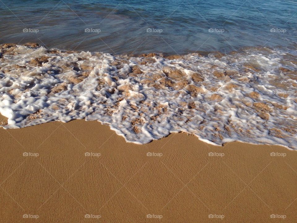 Wave hits Sand