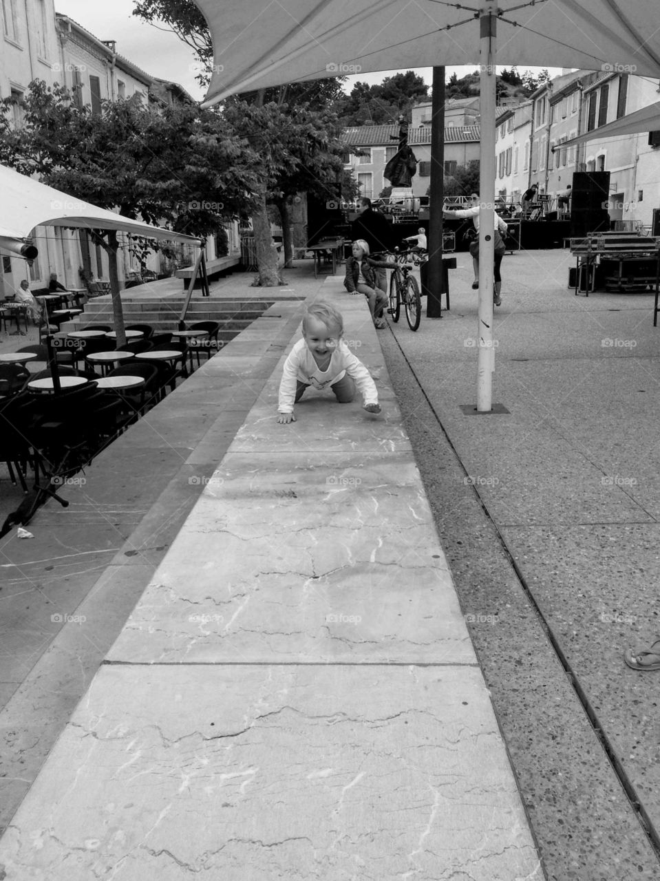 Girl crawling on square in Leucat