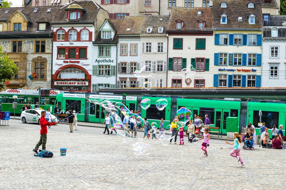 Children chasing bubbles
