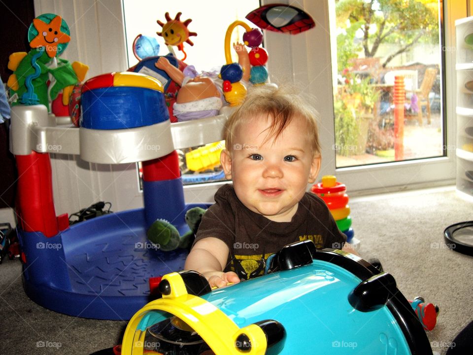 Toddler Playing With Colorful Toys
