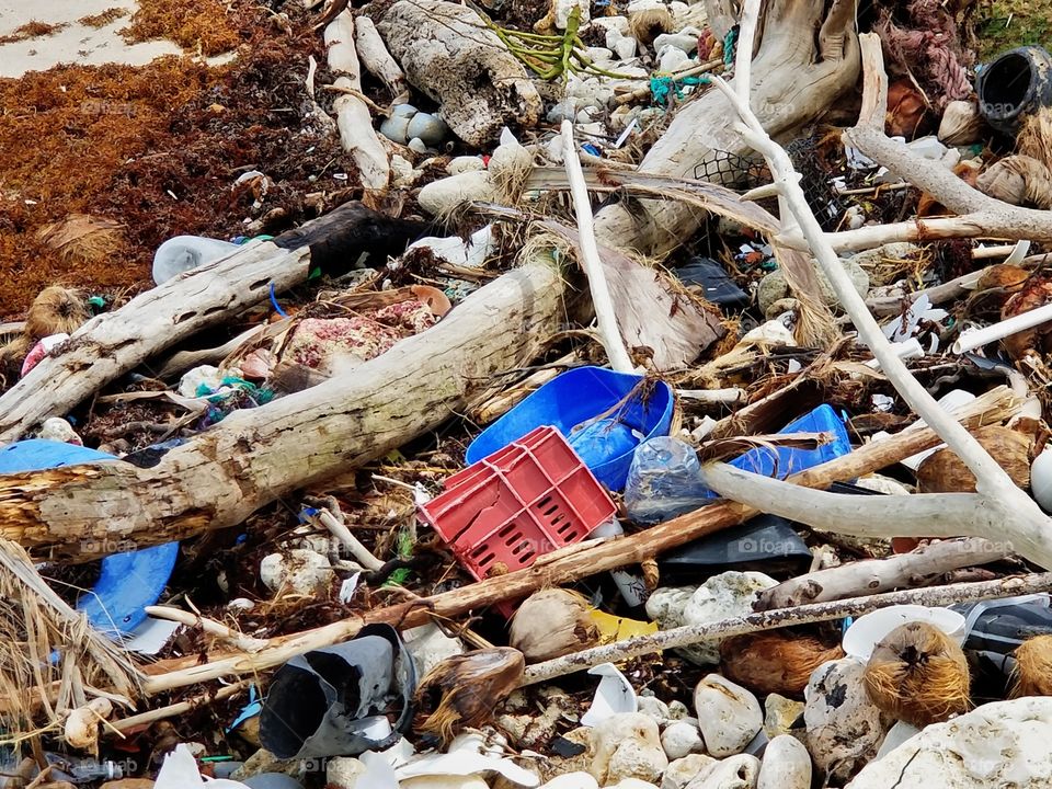 Trash that has been washing up to shore on Bathsheba beach from the 2018 hurricane