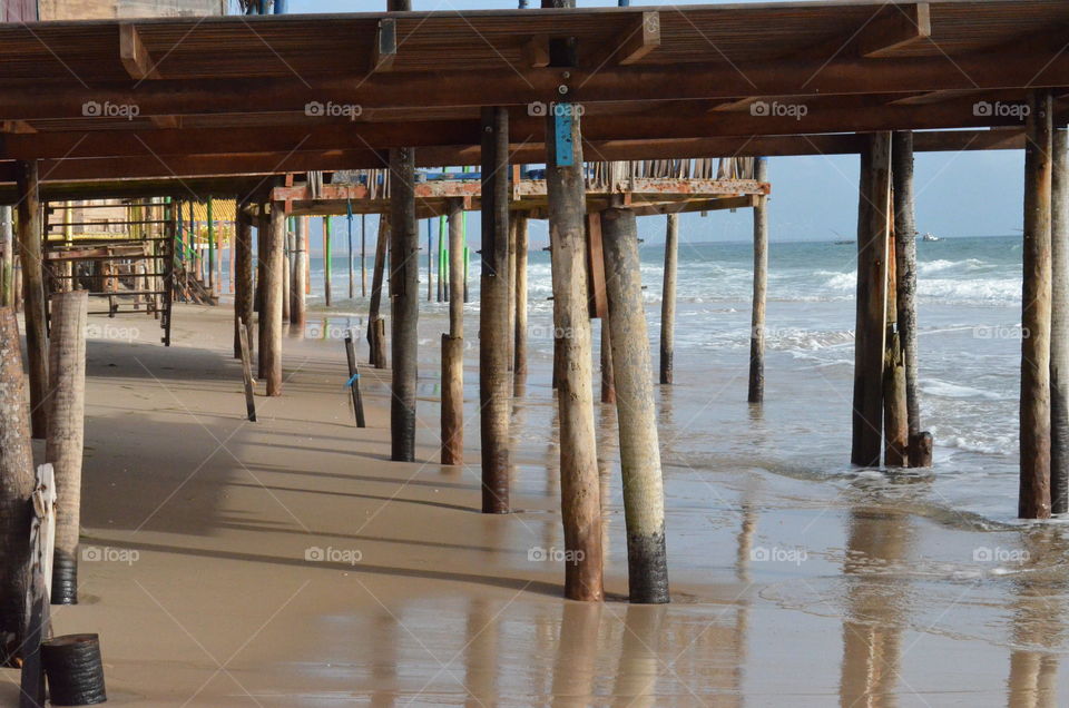 Canoa quebrada beach. Poles supporting beach bars . Ceara Brazil 