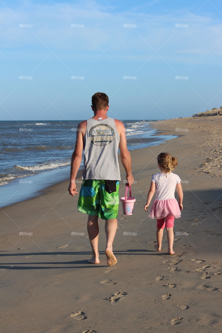 daddy and daughter at the beach