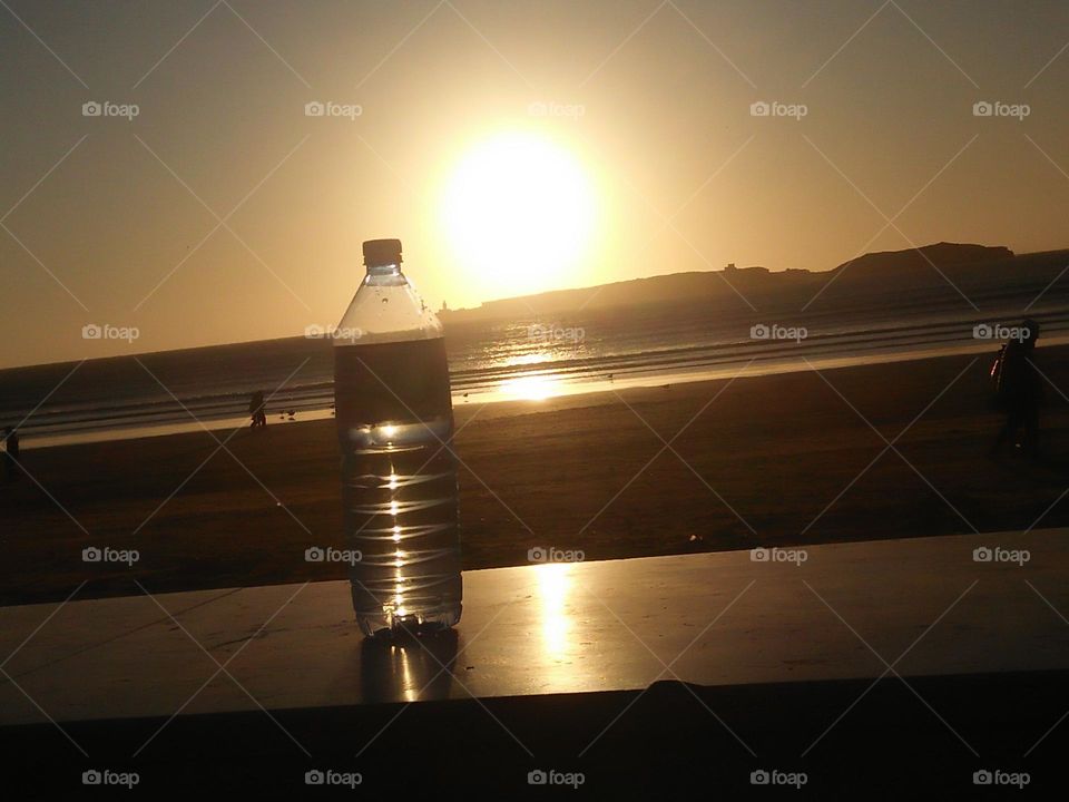 Magic sunset and a bottle towards the sun.