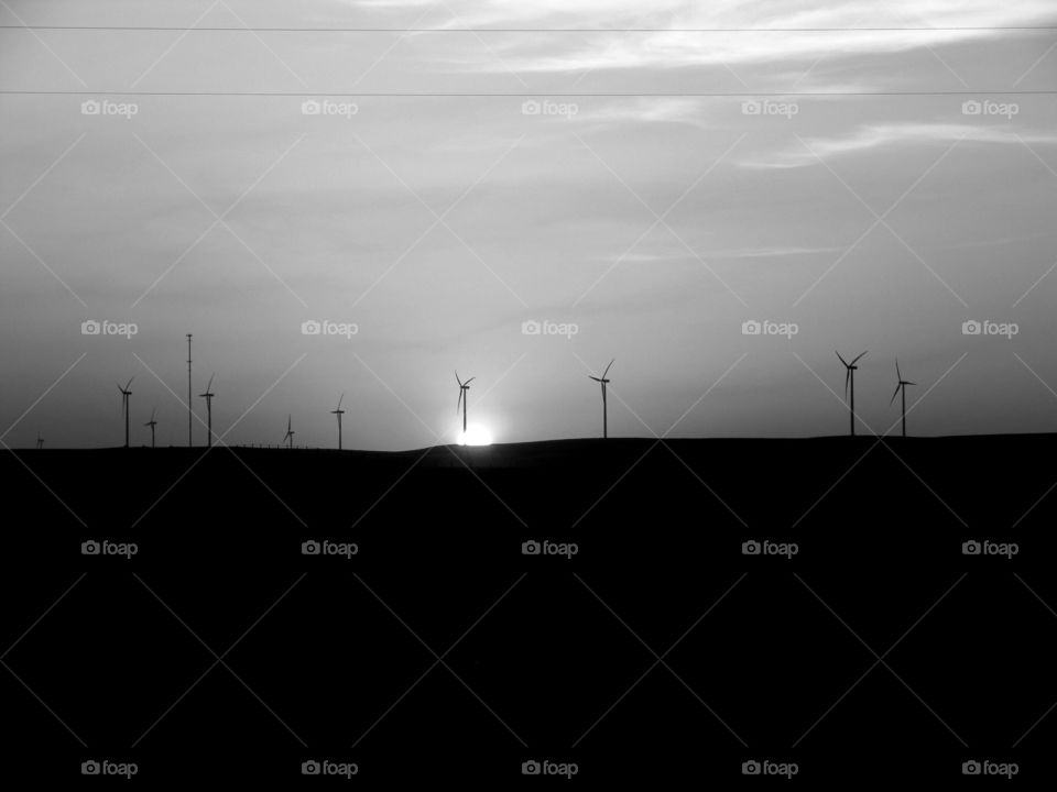 Black Sunset . Black and white sunset behind wind turbines in the Kansas plains.