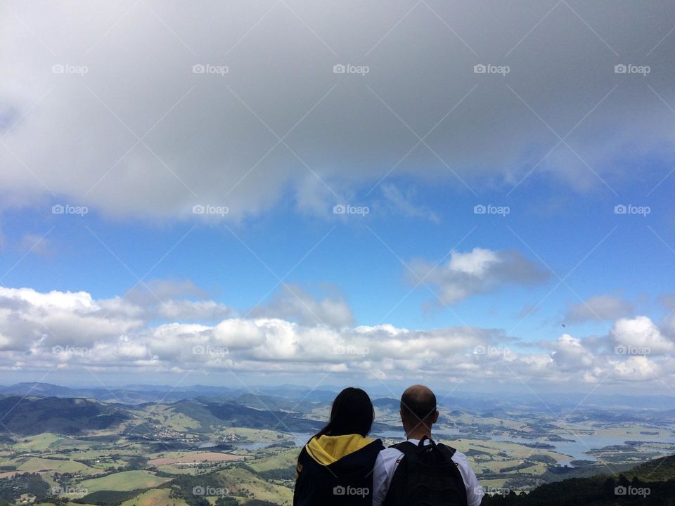 Beautiful landscape of the hills from the mountain in a cloudy blue sky