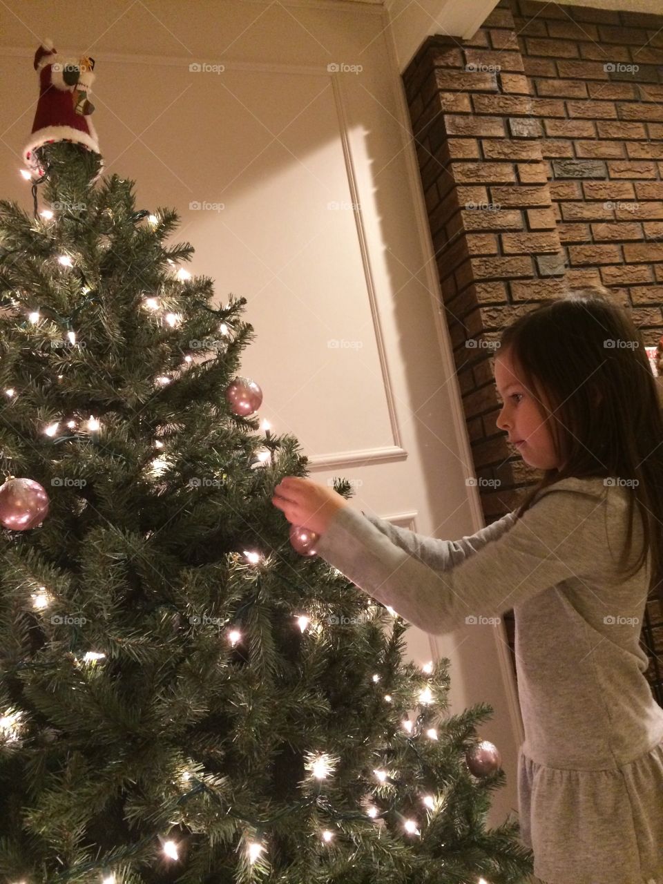 Decorating the Christmas tree.