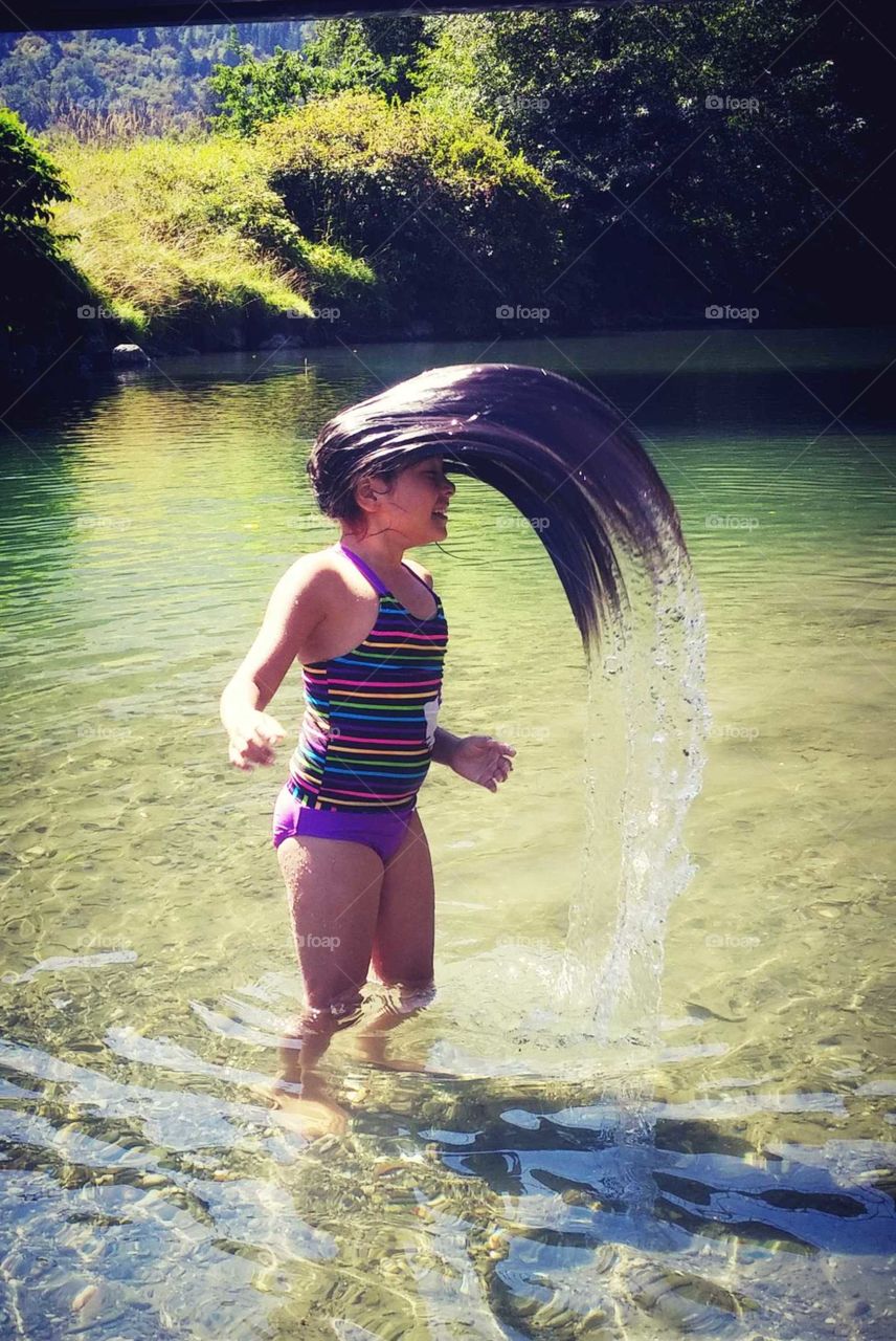 summer time fun at the river whipping the hair