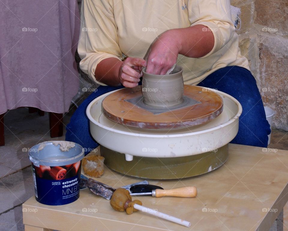 Ceramist working on a wheel